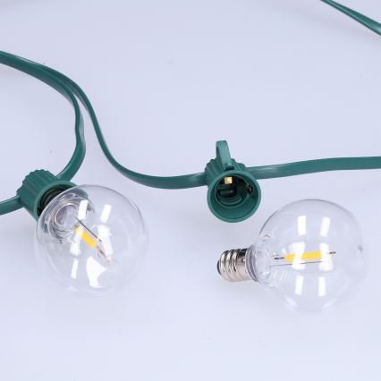Brilagi - LED-Außen-Dekorationskette GIRLANDA 25xE12/0,8W/230V 20m grün IP44 warmweiß