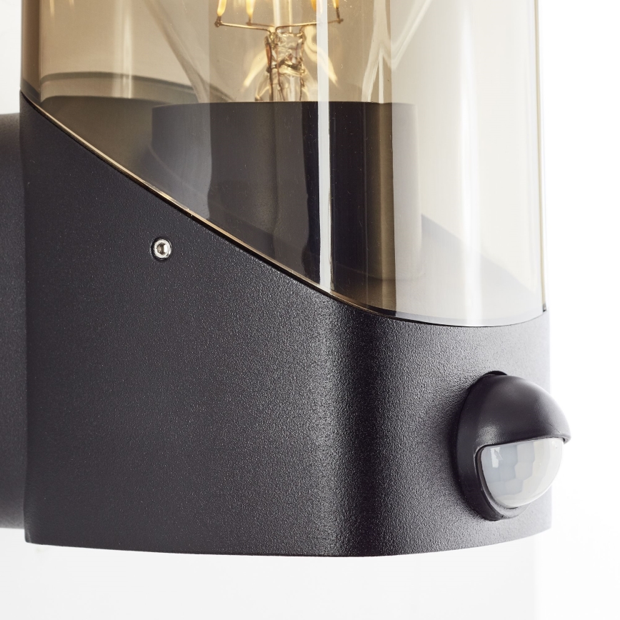 Brilliant - Outdoor-Wandleuchte mit Sensor MINOU 1xE27/10W/230V IP44 schwarz/rauchig