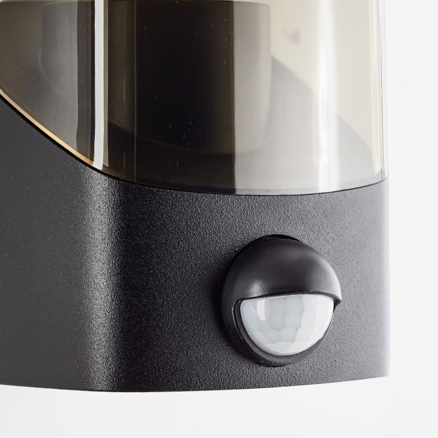 Brilliant - Outdoor-Wandleuchte mit Sensor MINOU 1xE27/10W/230V IP44 schwarz/rauchig