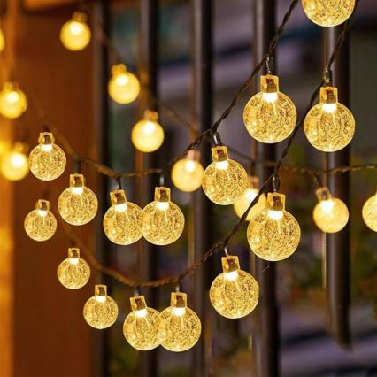 LED-Solar-Deko-Lichterkette 50xLED/8 Funktionen 500 mAh 9,5 m IP67 warmweiß