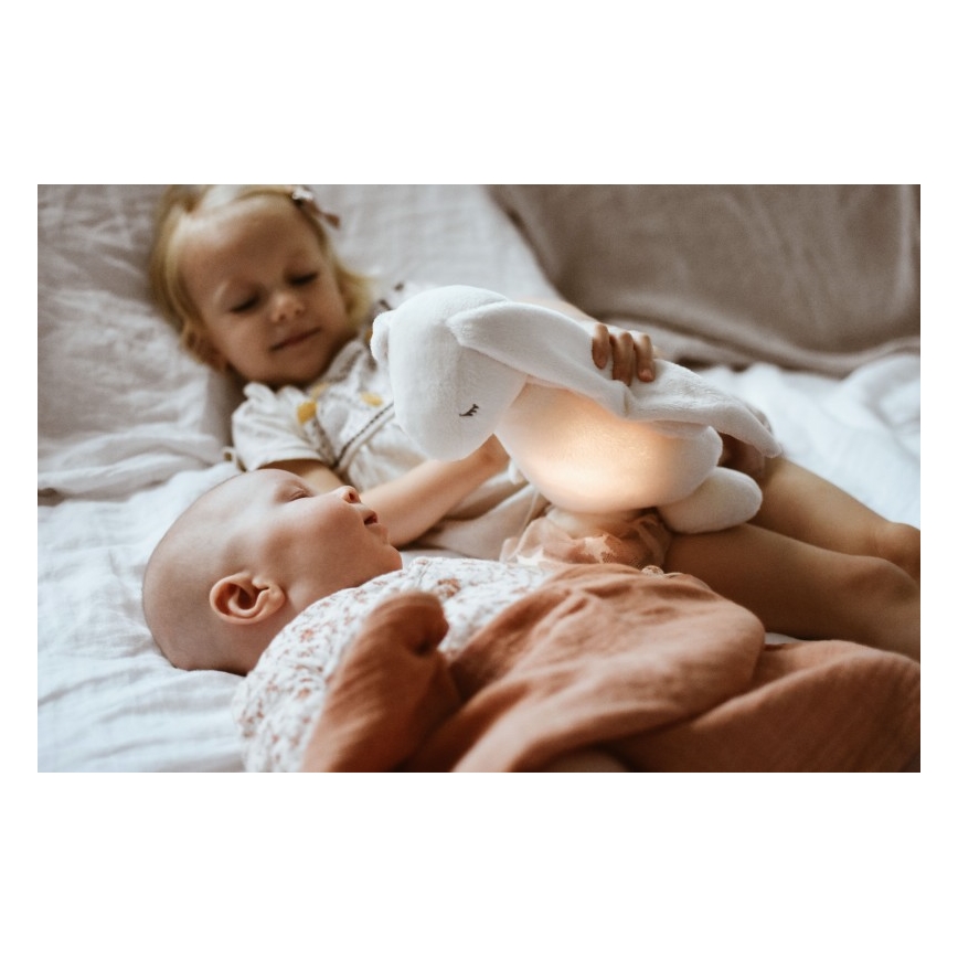Moonie - Kuscheltier mit Melodie und Licht Hase Powder